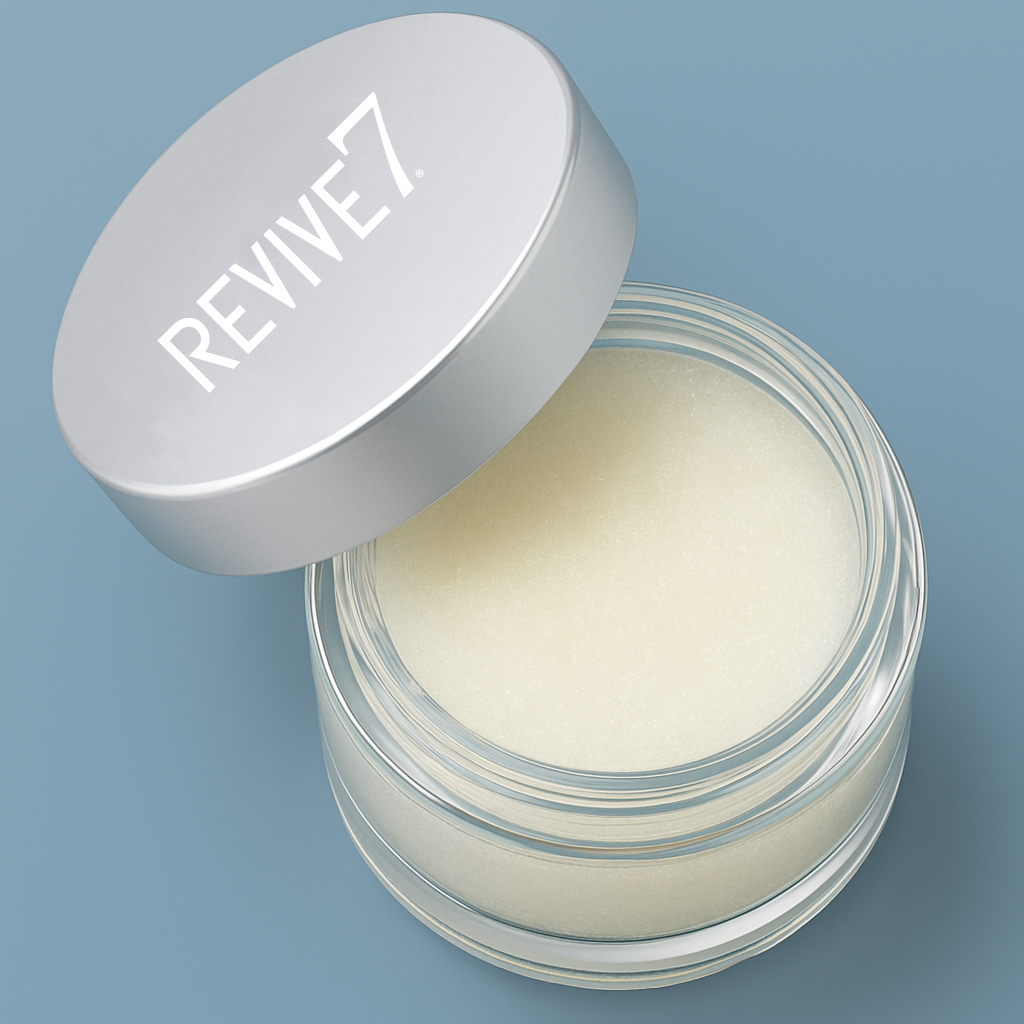 Open jar of cream with 'REVIVE7' lid on a blue background